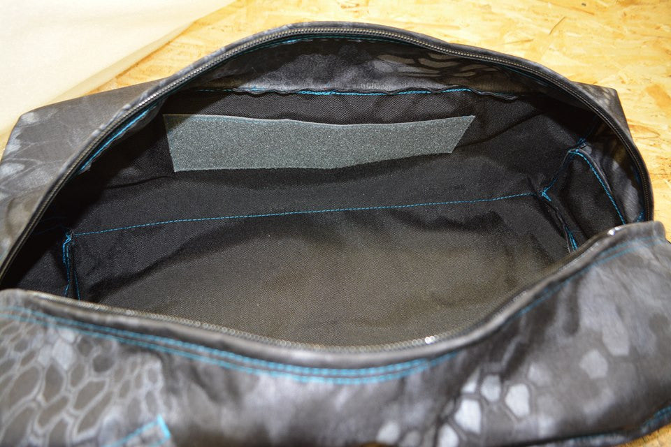 Velcro inside to attach velcro backed cards and mesh pockets to organize items.